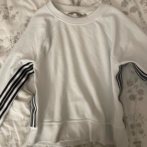 Athleta white sweatshirt with black stripes.